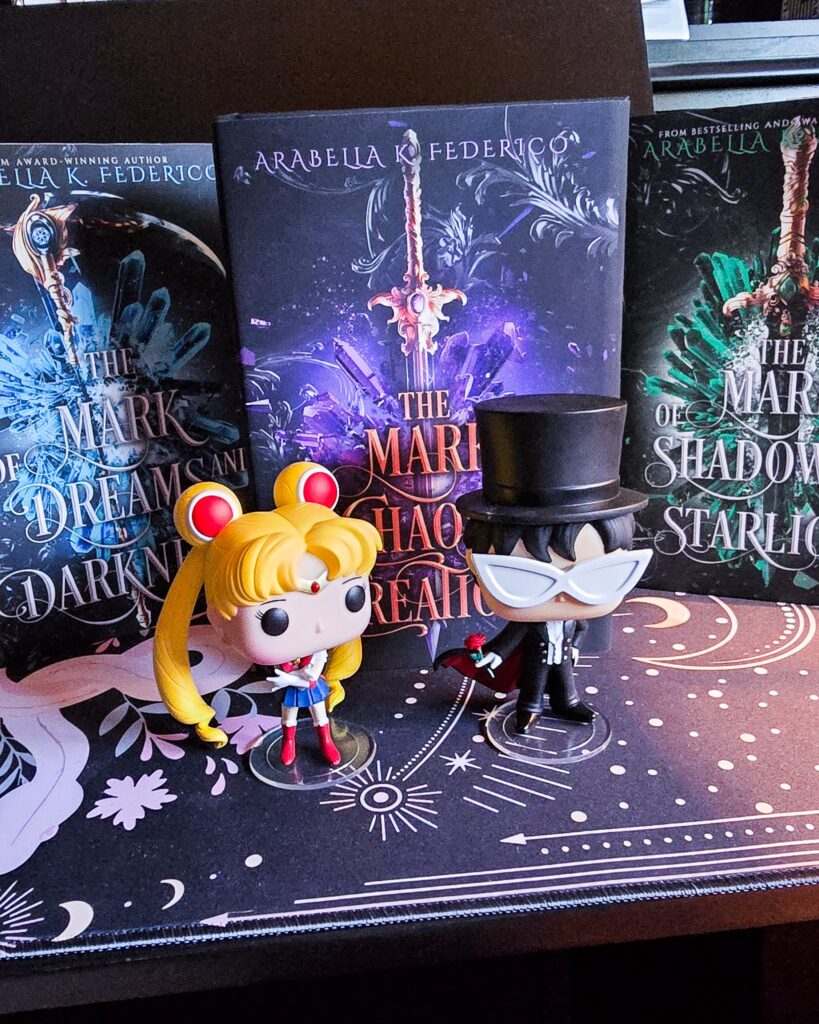 Sailor Moon, Sailor Moon romantasy books, Sailor Moon books for adults, celestial fantasy, celestial romantasy, Sailor Moon retelling masked prince villain romance, cosmic romantasy, cosmic fantasy, spicy Sailor Moon, spicy sailor moon retelling for adults, dark sailor moon, dark sailor moon retelling, the original Sailor Moon retelling, villain Tuxedo Mask